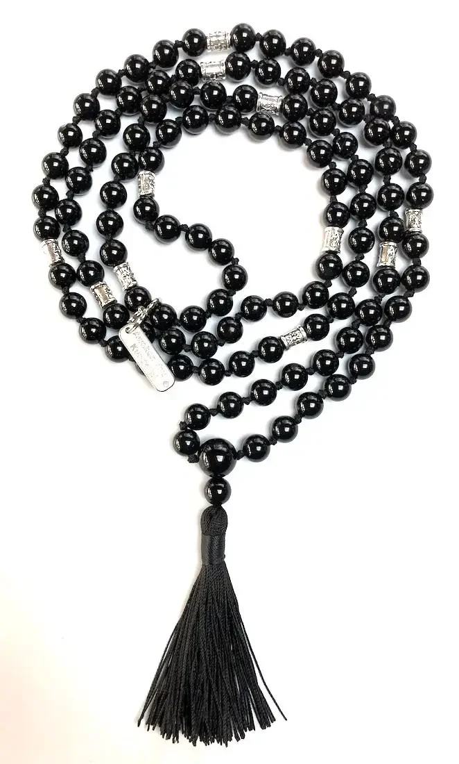 A Black Onyx Hand Knotted Mala Necklace designed to support the Root Chakra, offering protection, grounding, and strength, resonating with Sagittarius and Capricorn zodiac signs.