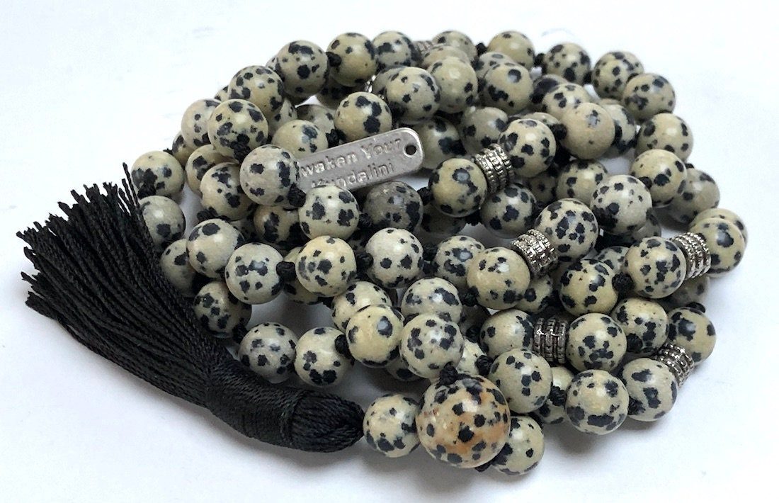 Dalmatian Jasper Mala Necklace featuring 108 hand-knotted Dalmatian Jasper beads, designed to promote joy and grounding. Ideal for meditation and spiritual practices, aligning with the Root and Sacral Chakras, and resonating with Gemini and Virgo. 