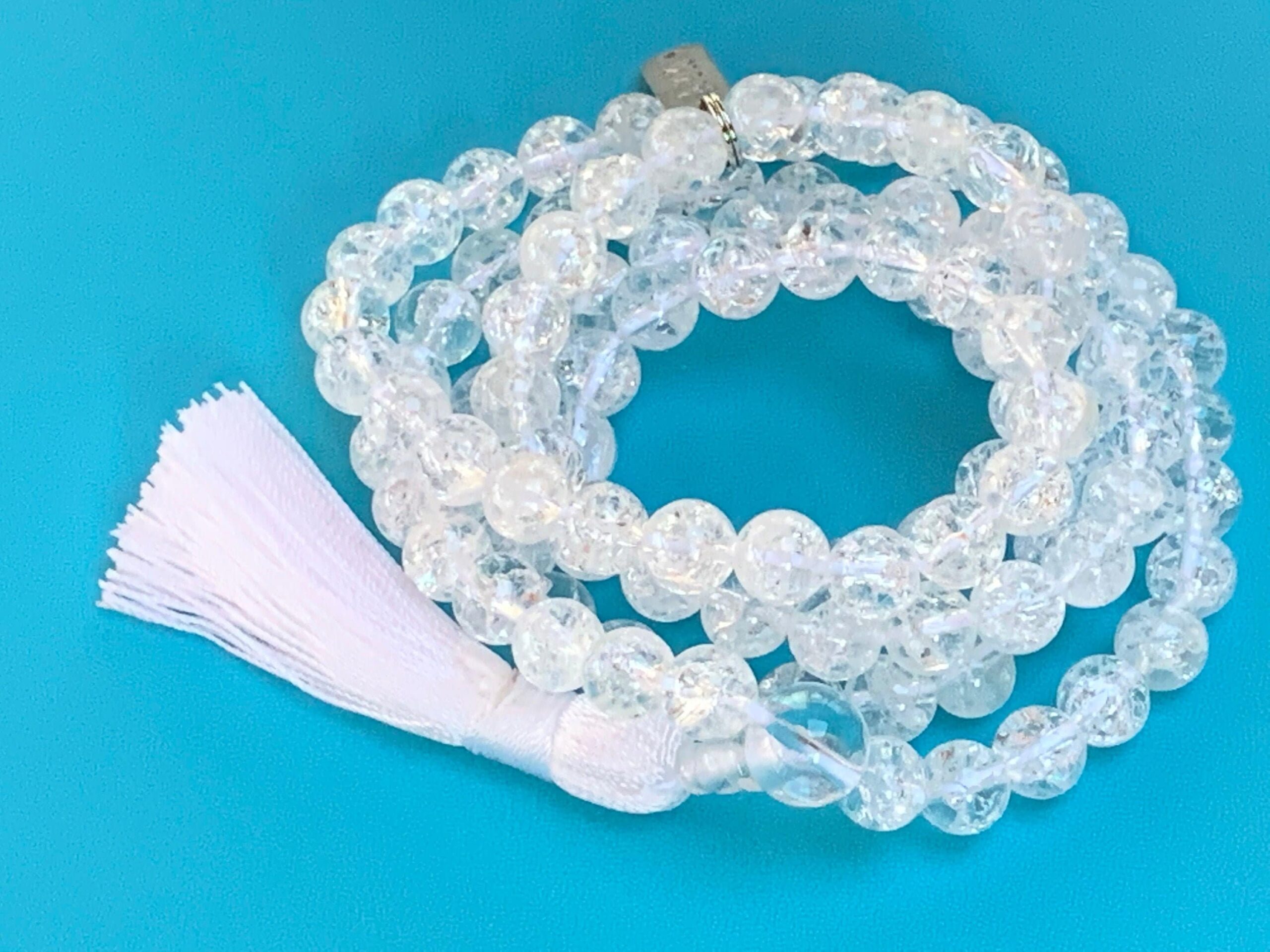 Crystal Quartz Himalayan Ice Mala Necklace designed to activate the Crown Chakra, offering clarity and spiritual awakening, suitable for all zodiac signs and crafted with pure Himalayan Ice Crystal Quartz.