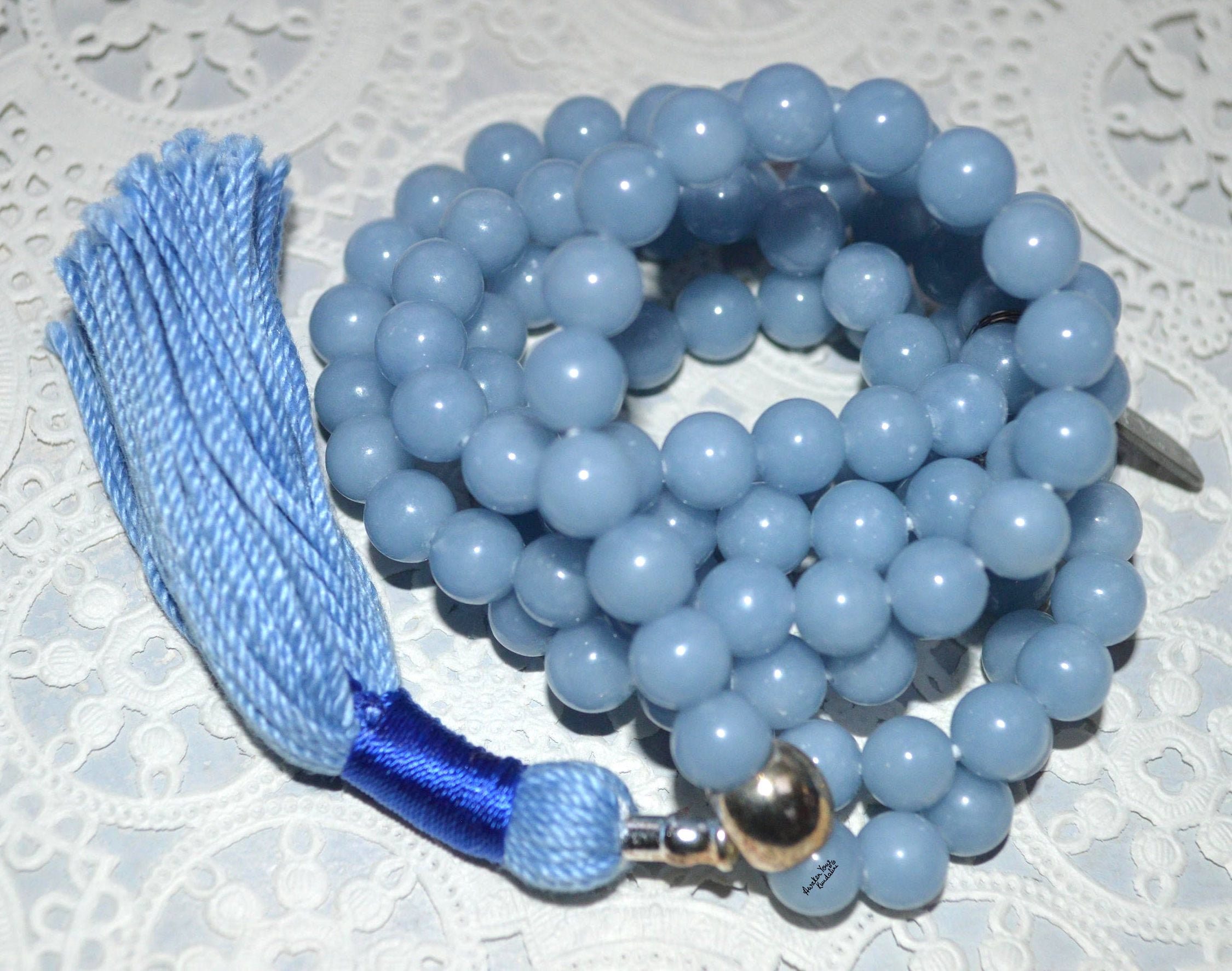 Celestial Angelite Mala Beads Necklace designed for Throat and Crown Chakras, ideal for Aquarius, promoting spiritual communication and peace.