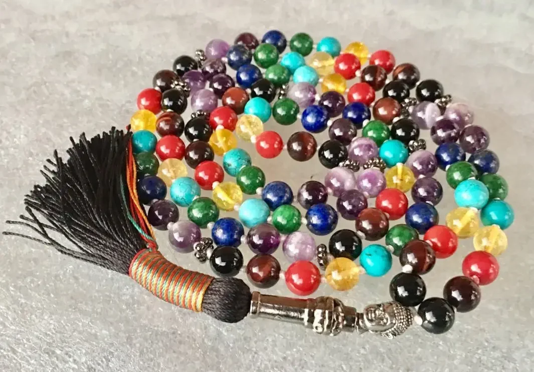 A 7 Chakra Mala Necklace featuring a combination of gemstones representing each of the seven chakras, designed for chakra alignment, balance, and spiritual growth.