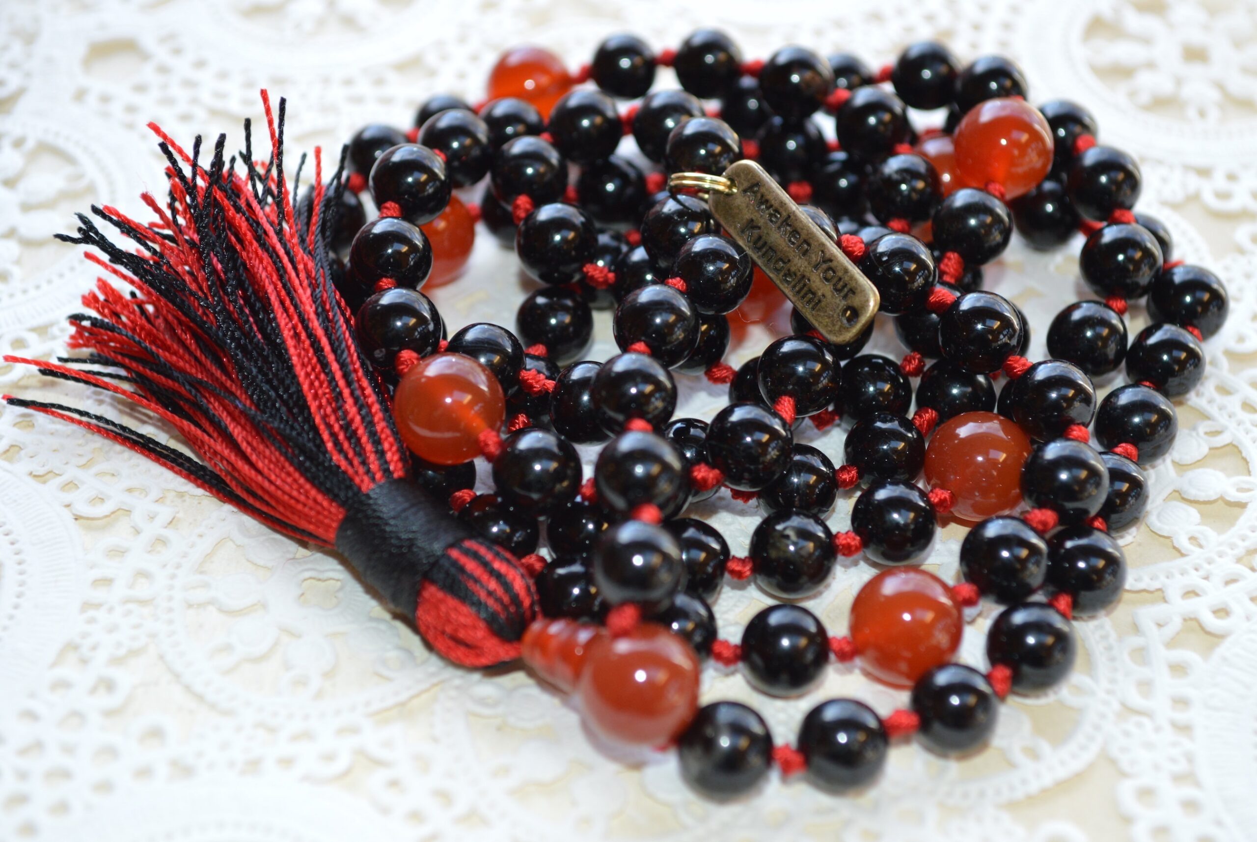 Black & Red Onyx Mala Beads Necklace designed for Root and Sacral Chakra balance, strength, and passion, associated with Leo and Scorpio.