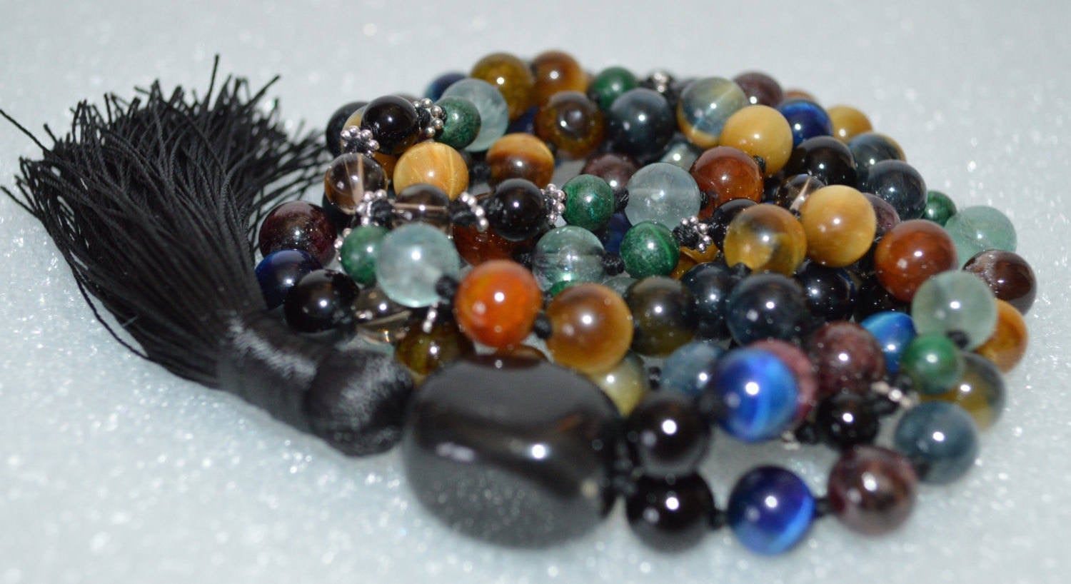 Blue Hawk's Eye and Gray Golden Tiger Eye Mala Necklace with Garnet, Malachite, Fluorite, Smoky Quartz, Onyx, Carnelian, Mahogany Obsidian, and Tourmaline Mala Necklace, designed for grounding, protection, and focus.