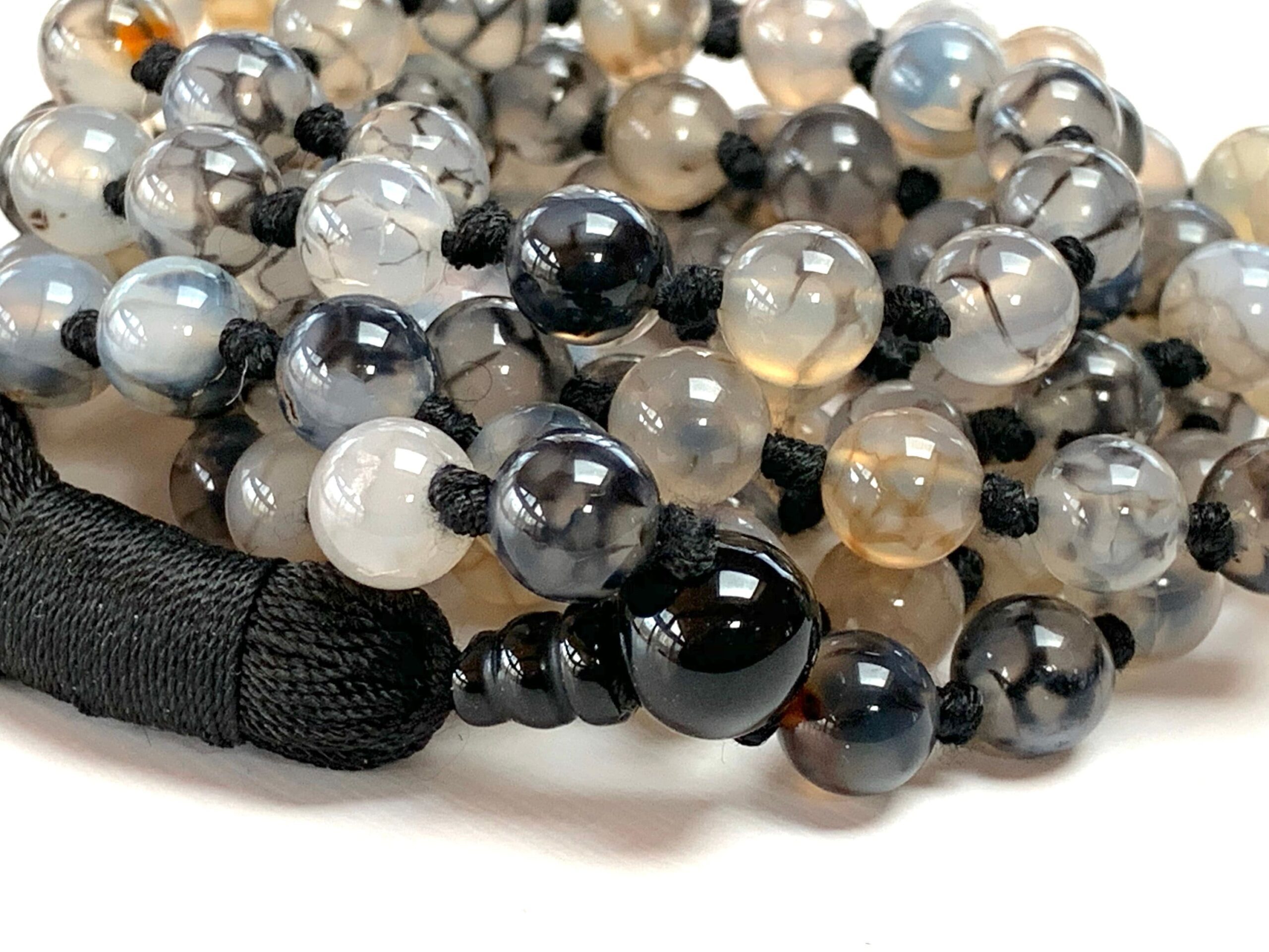 Dragon Vein Agate Mala Necklace featuring 108 hand-knotted beads, designed to activate the Root and Sacral Chakras. Perfect for Aries and Scorpio, it enhances grounding, creativity, and emotional balance.