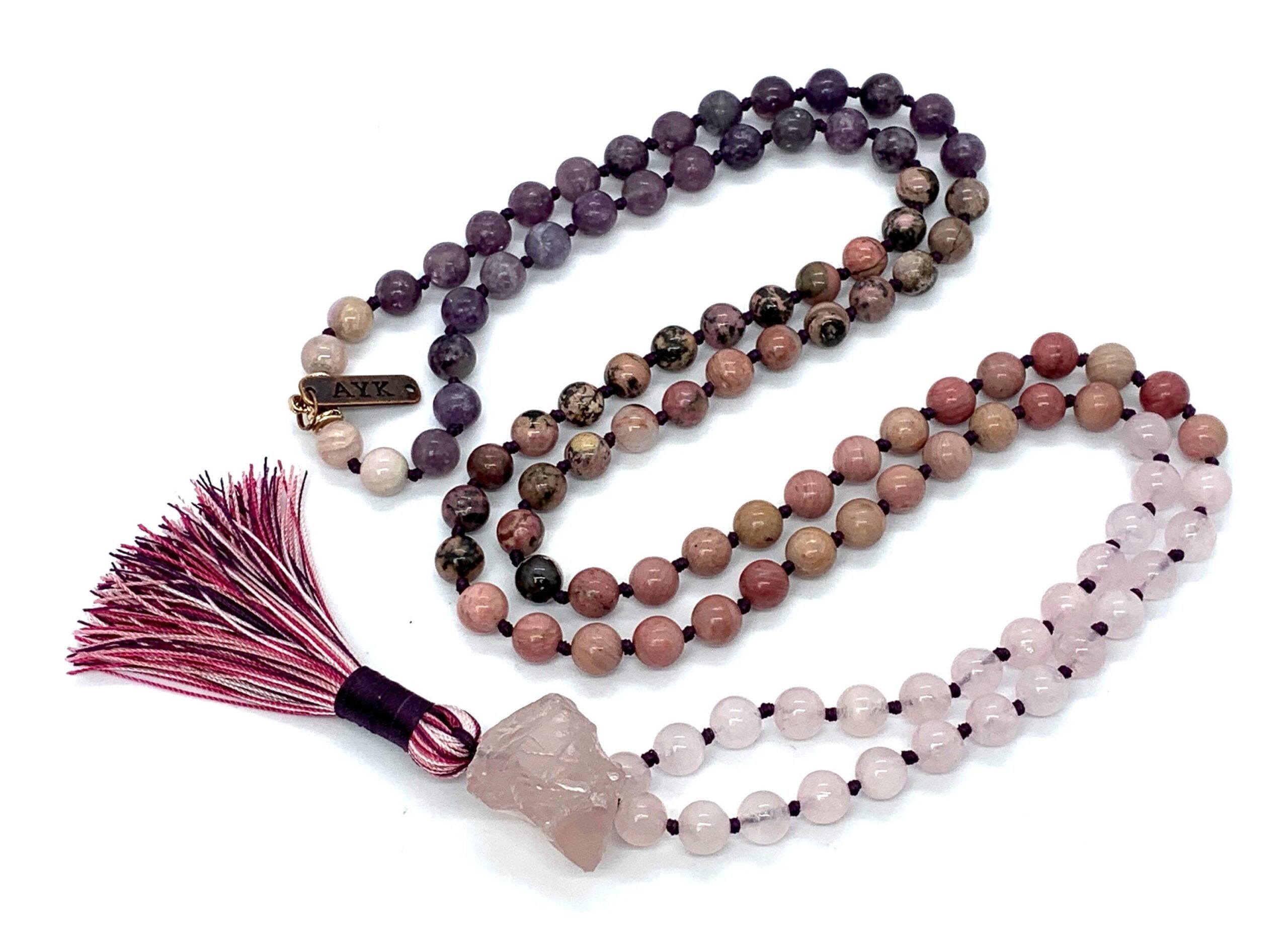 A Love Mala Necklace featuring Rose Quartz, Rhodonite, Pink Opal, Kunzite, and Charoite beads, designed for Heart Chakra support, emotional healing, and attracting love, with energies aligned with Libra and Taurus.