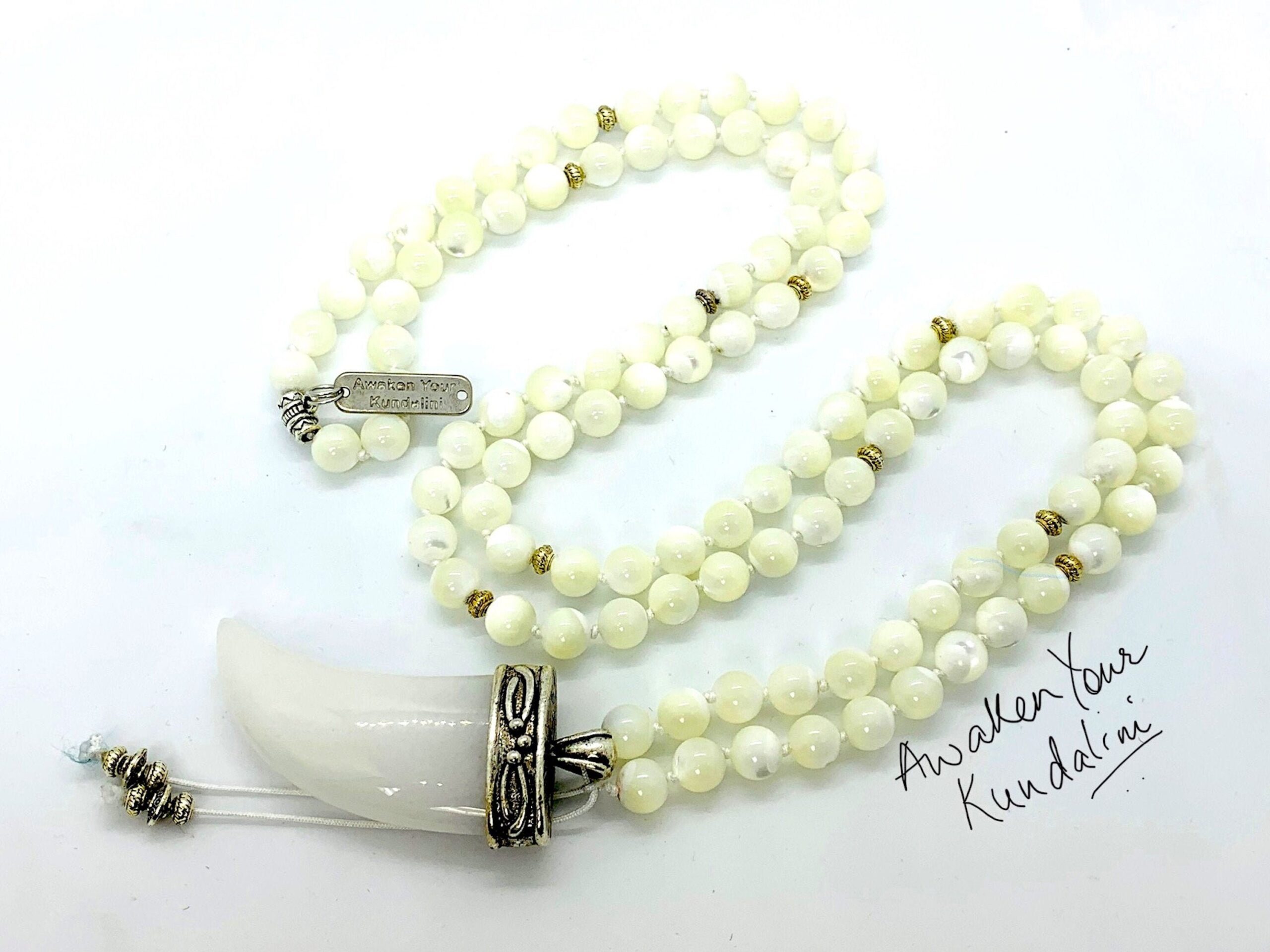 Mother of Pearl Mala Necklace designed to support the Heart Chakra, enhancing emotional healing and inner peace, with beads resonating with Cancer for emotional balance and tranquility.