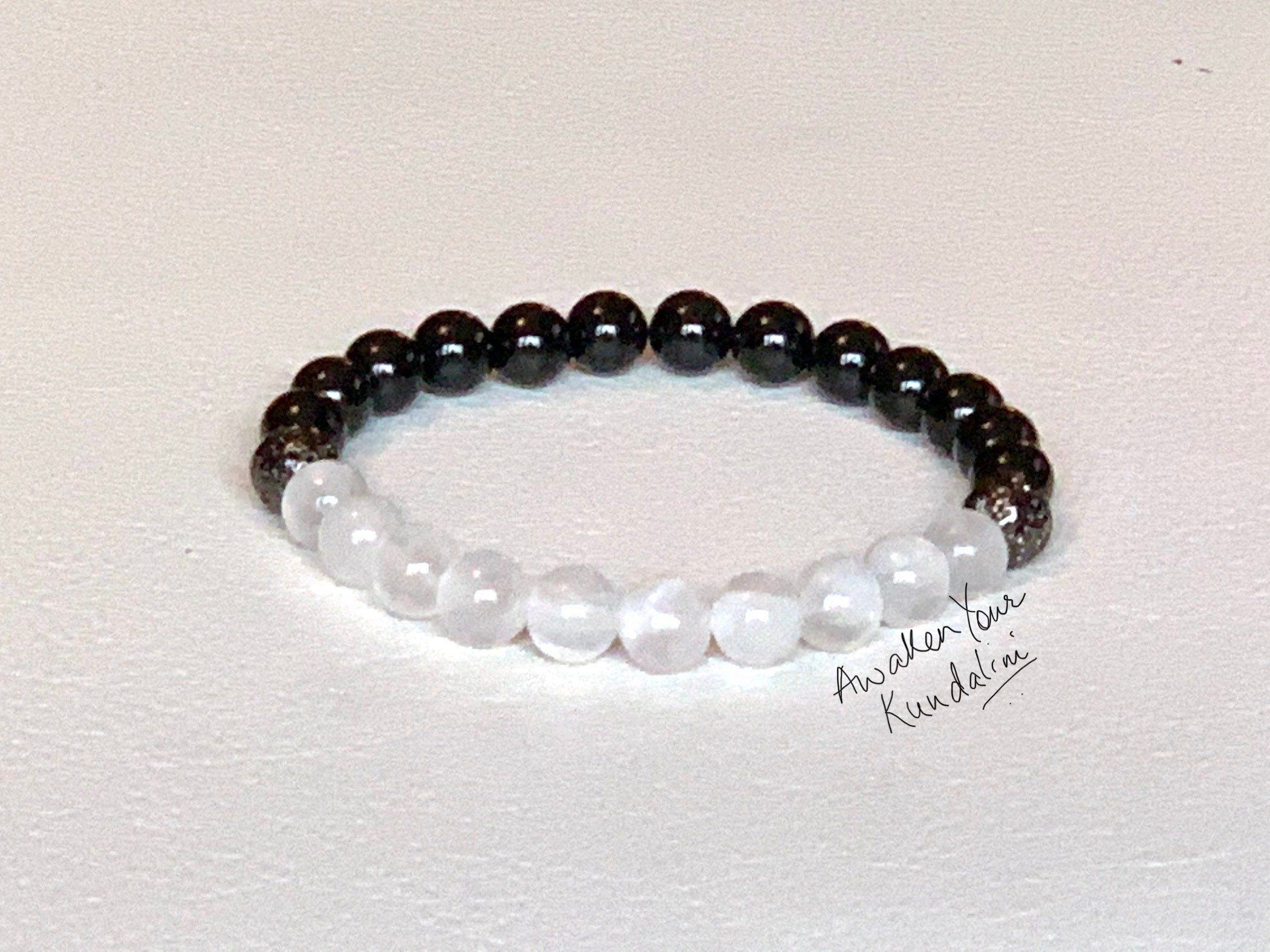 Selenite and Black Tourmaline Bracelet featuring cleansing and grounding gemstones, designed to align with Capricorn, Aries, and Taurus sun signs and support both the Root and Crown Chakras.