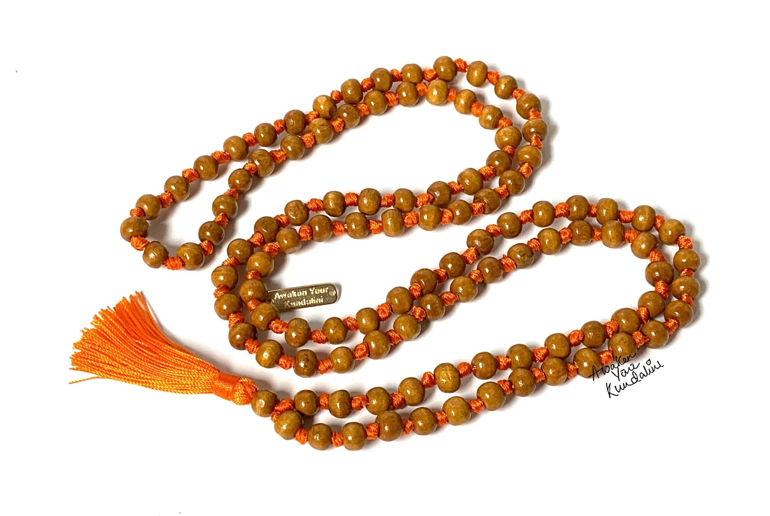 Tulsi Mala Beads Necklace crafted from natural Tulsi wood with 108 beads and a tassel, symbolizing spiritual purity and protection.