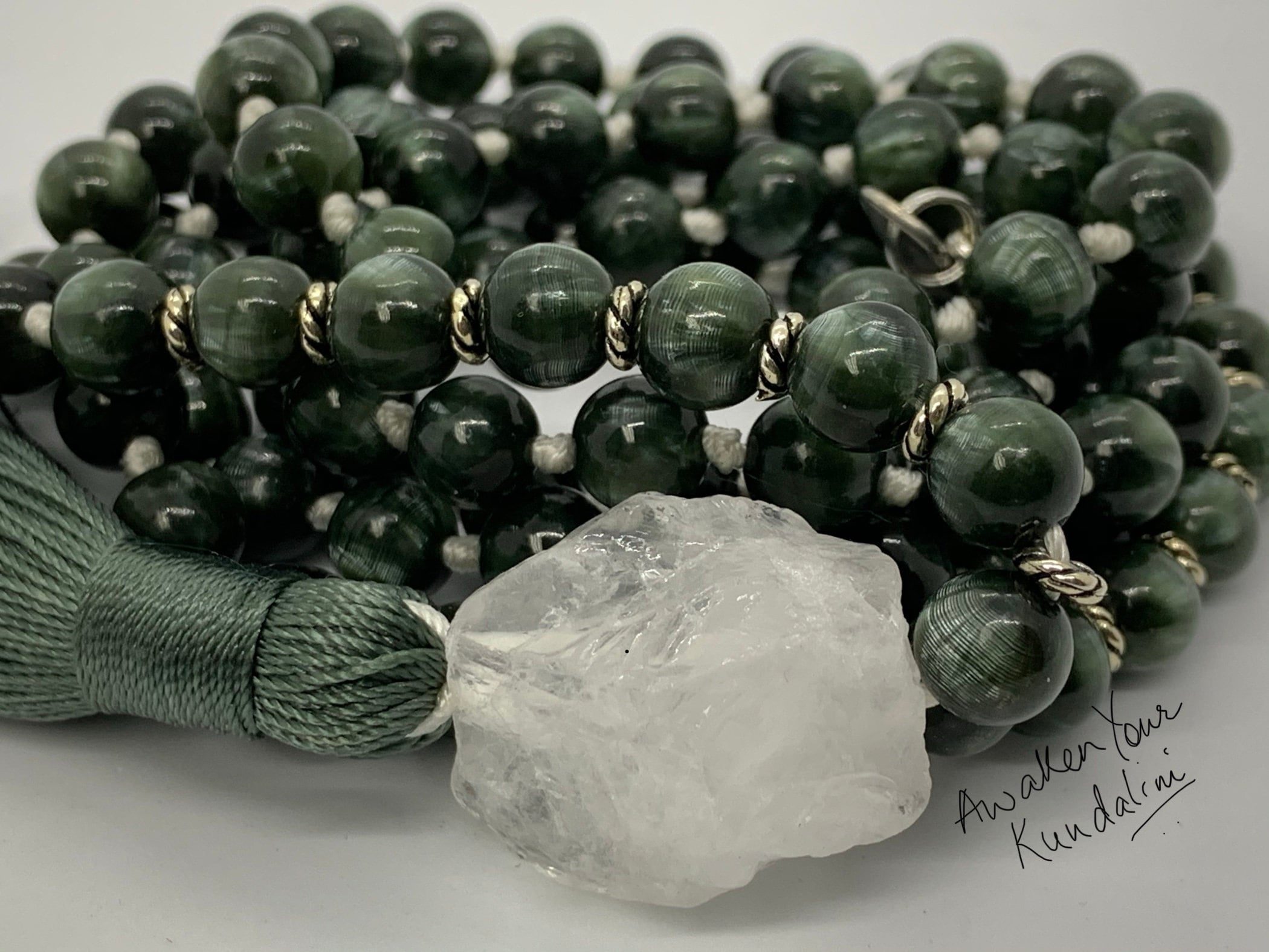 Gorgeous deep green colored hand-knotted Seraphinite Mala Necklace designed to resonate with the Heart Chakra and Sagittarius zodiac, promoting healing, spiritual growth, and divine connection.