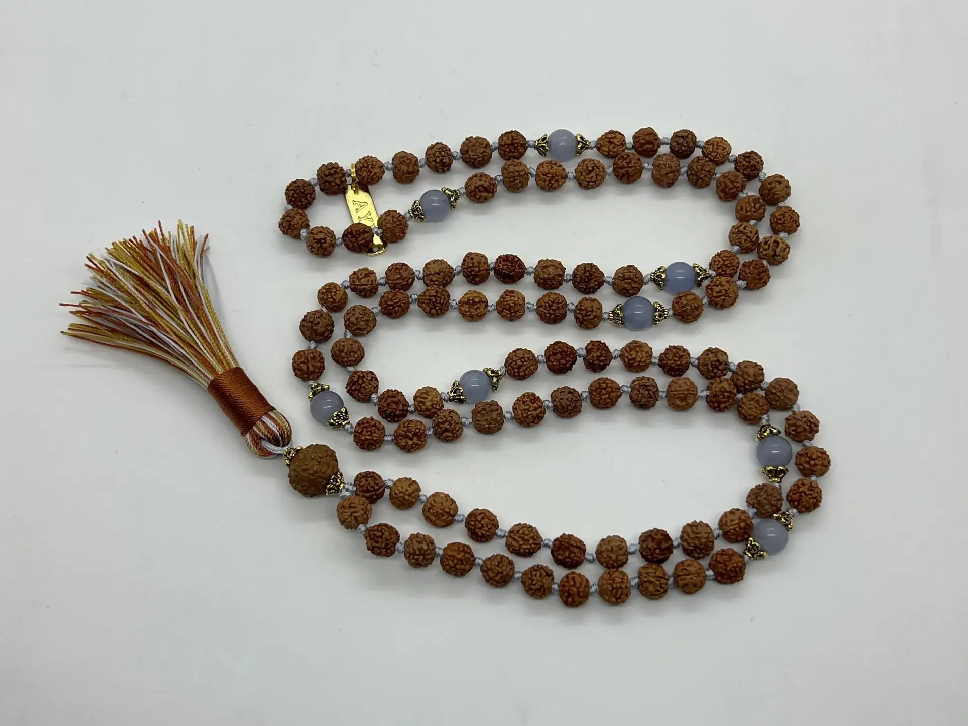 Rudraksha Kriya Mala Beads Necklace featuring 108 beads, including the Guru bead, designed for Root Chakra balance and spiritual devotion for Parmahansa Yogananda Oriya mala