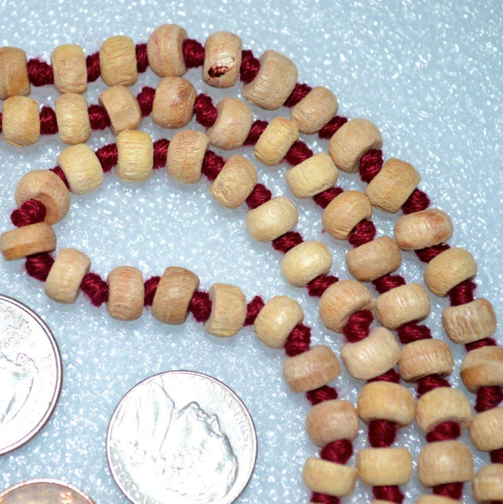 Hand Knotted Tulsi Mala Necklace featuring 108 hand-knotted Tulsi wood beads, designed for spiritual purity, protection, and deep devotion. Aligns with the Heart and Crown Chakras, suitable for all zodiac signs.