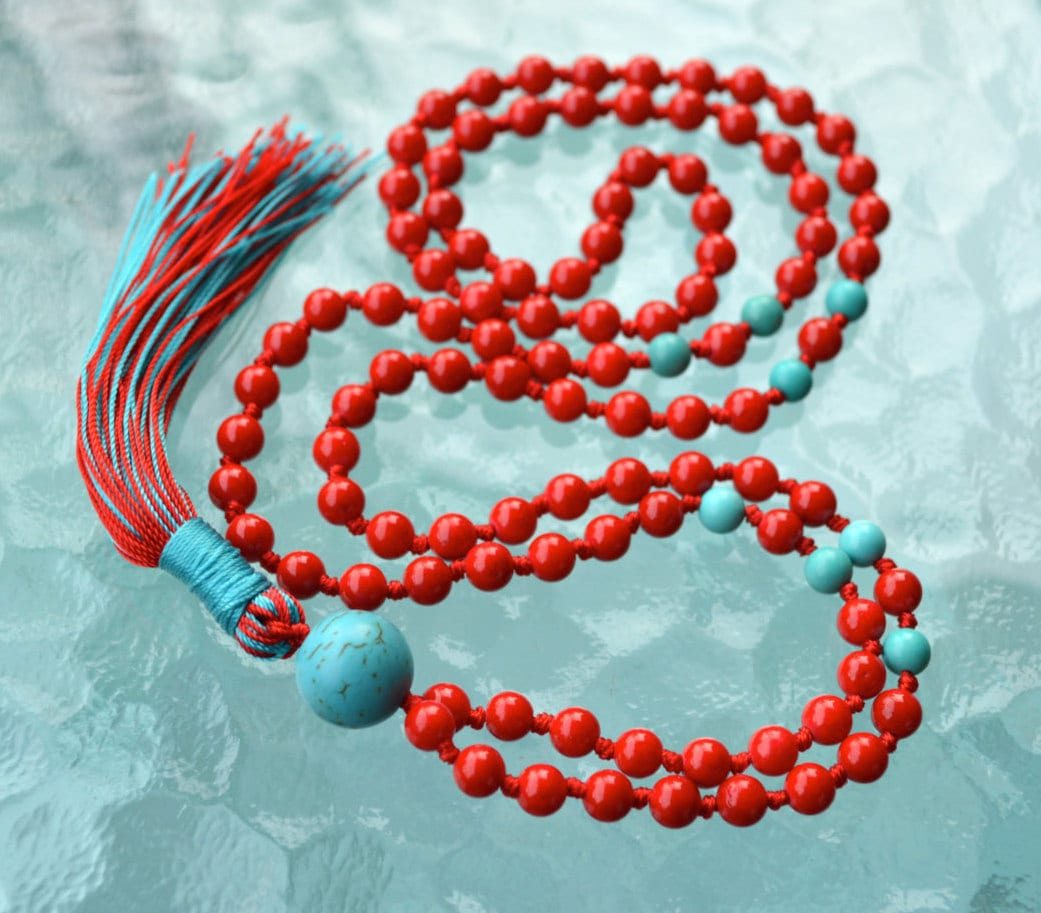 Red Coral and Turquoise Hand Knotted Mala Necklace designed for Root and Throat Chakra support, enhancing strength, vitality, and communication, with gemstones resonating with Aries and Sagittarius.