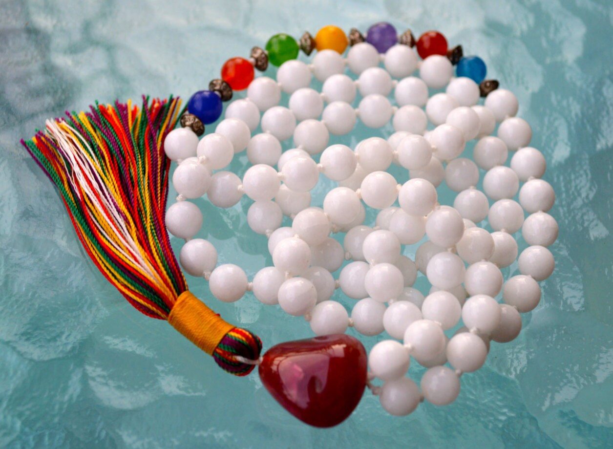  7 Chakra Mala Necklace featuring 108 hand-knotted gemstone beads, each representing one of the seven chakras. Designed for full chakra alignment, balance, and healing. Ideal for meditation and spiritual growth, resonating with all zodiac signs.