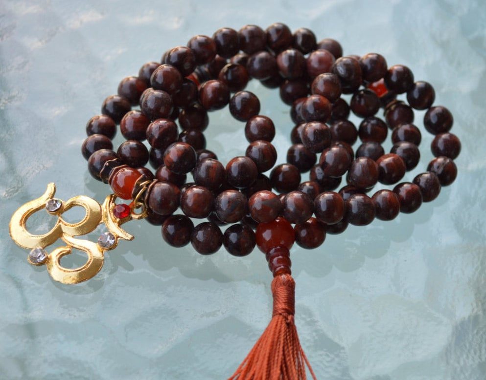 Mahogany Obsidian & Carnelian Mala Necklace designed for Root and Sacral Chakra support, enhancing grounding, passion, and personal power, with gemstones resonating with Aries and Scorpio.